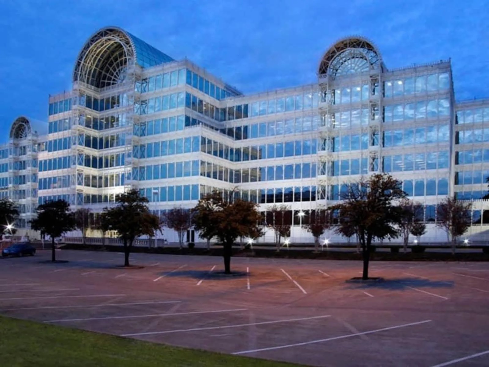 Glass office building in Dallas–Fort Worth at dusk